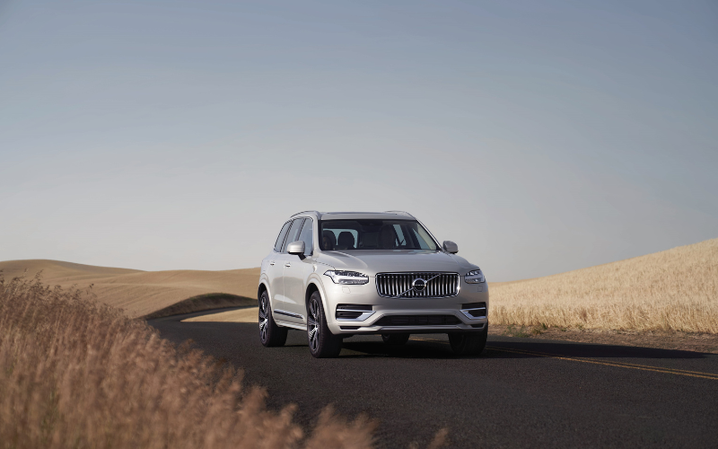 volvo XC90 driving through a deserted landscape